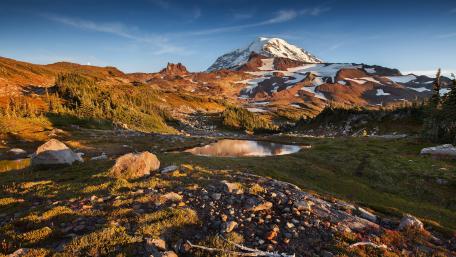 Majestic Mountain Landscape Beneath Clear Blue Skies wallpaper