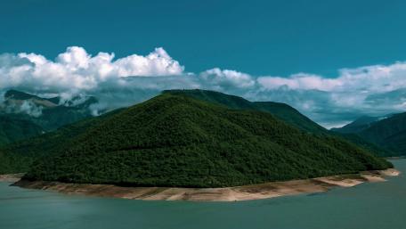 Serene Mountain Island Surrounded by Water wallpaper