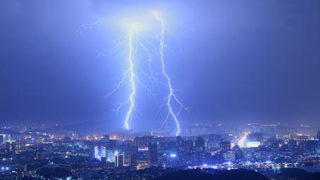 Electrifying Cityscape in Blue wallpaper