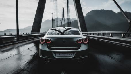 Sleek Hyundai Under a Rainy Bridge Scene wallpaper