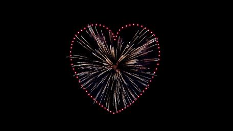 Heartfelt Fireworks Against a Dark Night Sky wallpaper