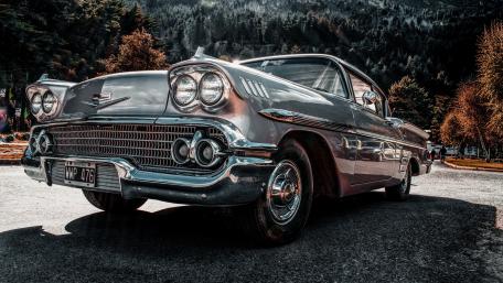 Classic Vintage Car in Scenic Landscape View wallpaper