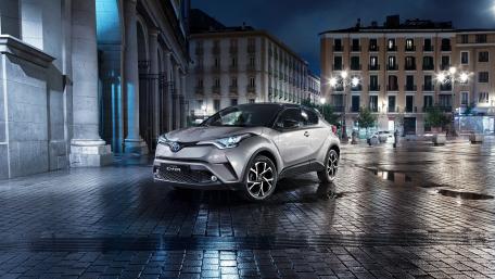 Sleek Toyota C-HR Under Night Lights wallpaper