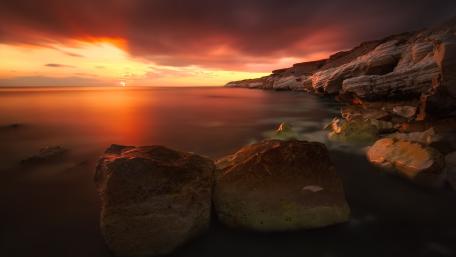 Serene Sunset Over Coastal Cliffs wallpaper