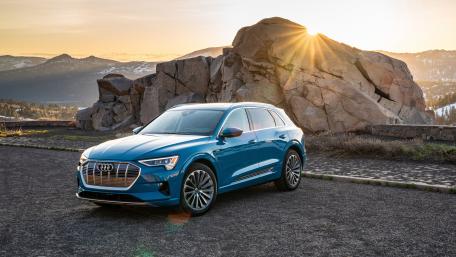 Sleek Audi e-tron in Nature's Embrace wallpaper