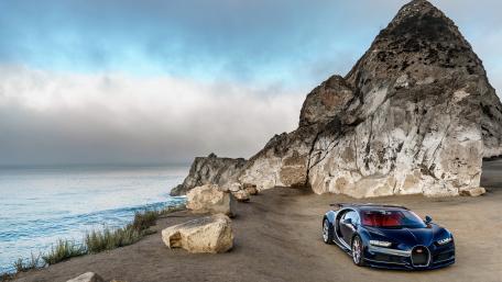 Sleek Elegance of the Bugatti Chiron by the Coastline wallpaper
