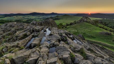 Stunning Sunset Over Rocky Outcrop in Nature wallpaper