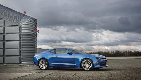 Blue Chevrolet Camaro in a Dramatic Sky Scene wallpaper