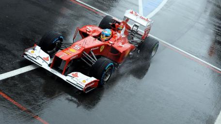 Racing Ferrari on Wet Asphalt wallpaper