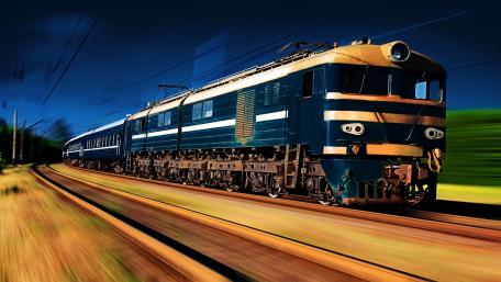 Electric Train Speeding Along the Rails wallpaper