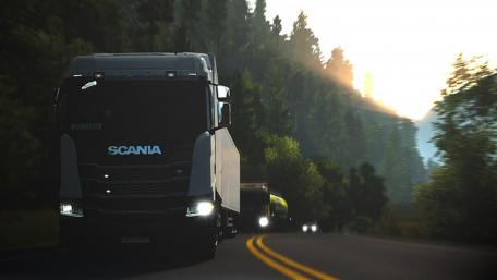Scania Truck on Serene Forest Road wallpaper
