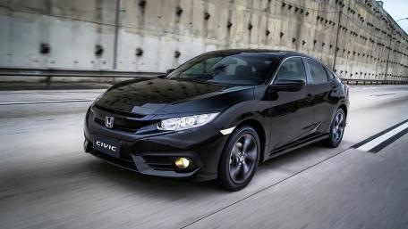 Sleek Honda Civic Power Driving Forward wallpaper