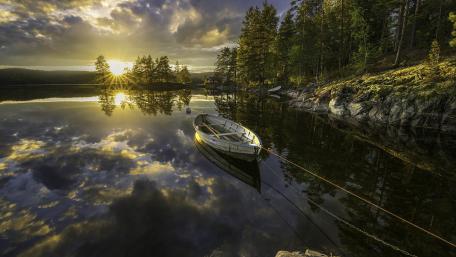 Serene Boat Reflection at Sunset wallpaper