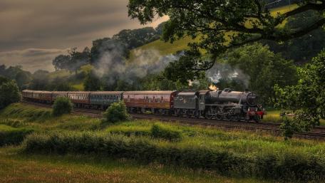 Vintage Steam Train in Countryside Landscape wallpaper