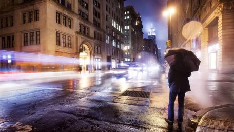 Rainy Night in the City with Umbrella and Lights wallpaper