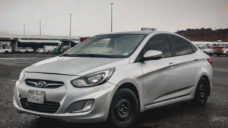 Sleek Hyundai Accent on Display in Vibrant Setting wallpaper