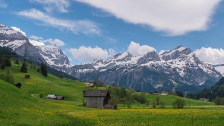 Serene Alps Landscape with a Rustic Shack wallpaper
