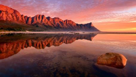 Serene Cliffs Reflecting in Tranquil Waters wallpaper