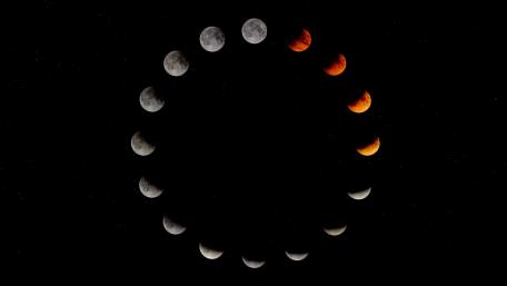 Moon's Mesmerizing Phases Against a Starry Night Sky wallpaper