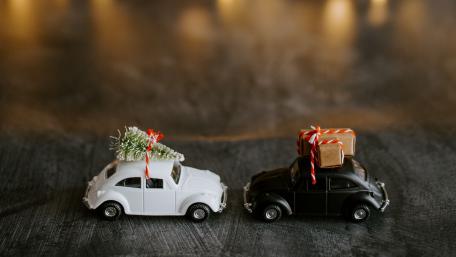 Festive Volkswagen Beetles Surrounded by Cheerful Decorations wallpaper