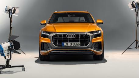 Stylish Audi Q8 SUV in Bold Orange wallpaper