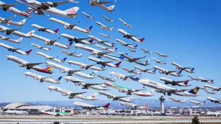 Dynamic Air Traffic Over an Airport Landscape wallpaper