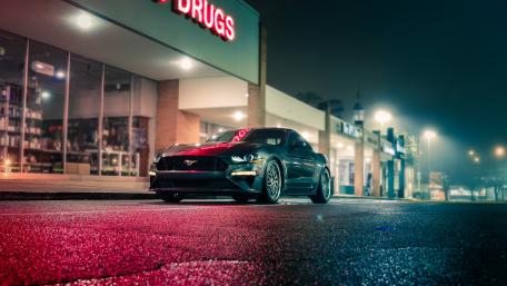 Nighttime Elegance Ford Mustang in the City Streets wallpaper