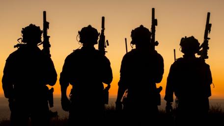 Silhouetted Soldiers at Sunset wallpaper