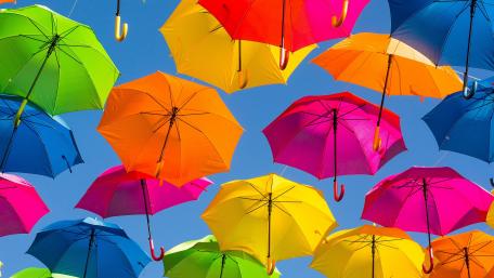 Vibrant Umbrellas Under Blue Sky wallpaper