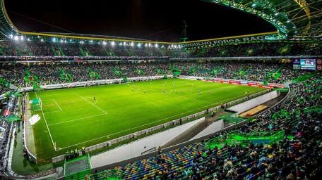Illuminated Stadium Brimming with Enthusiastic Fans wallpaper