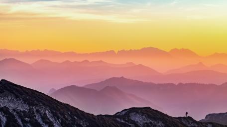 Majestic Sunrise Over Mountain Range wallpaper