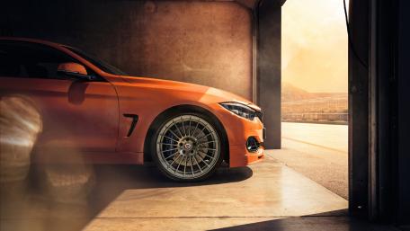 Powerful Alpina B4 in Vibrant Orange Hue wallpaper