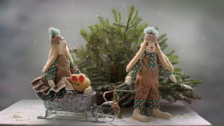 Charming Christmas Dolls in a Winter Scene wallpaper