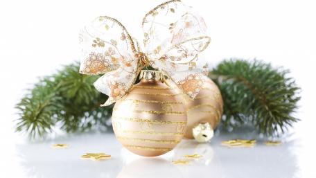 Golden Christmas Ornament with Bow and Pine Branches wallpaper