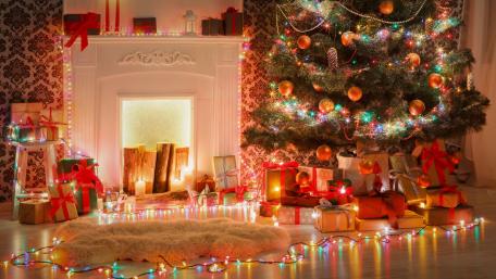 Festive Christmas Celebration with Beautiful Tree and Gifts wallpaper
