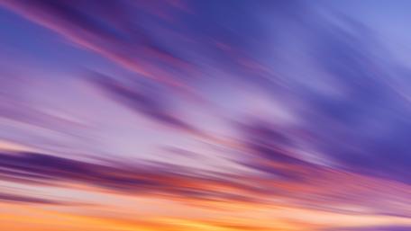 Vibrant Sunset Blurs in Twilight Sky wallpaper