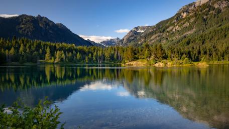 Serene Lake Against Majestic Mountains wallpaper