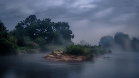 Misty Serenity Over a Foggy River Landscape wallpaper