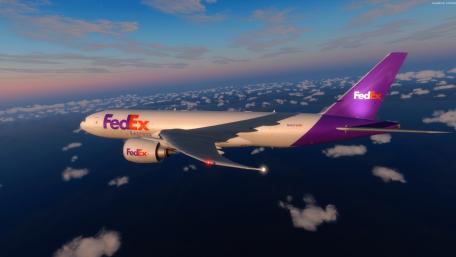 FedEx Boeing Airplane in Flight Over Clouds wallpaper