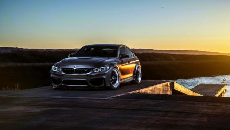 Sleek BMW Car Against a Sunset Backdrop wallpaper