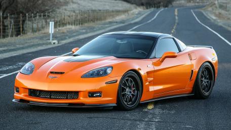 Vibrant Chevrolet Corvette on a Scenic Road wallpaper