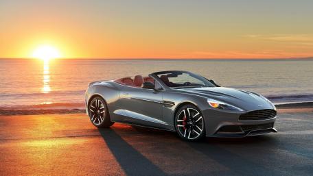 Sleek Aston Martin Vanquish at Sunset by the Ocean wallpaper