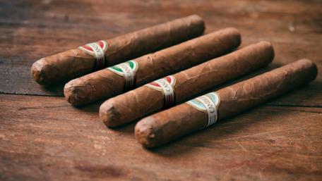 Cuban Cigars Arranged on Rustic Wood Background wallpaper