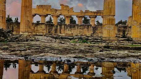 Ancient Ruins Reflecting History on Water Surface wallpaper