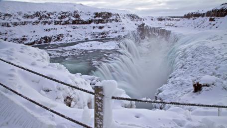 Majestic Winter Waterfall Scene wallpaper