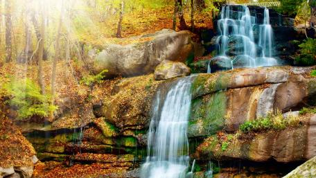 Serenity of Waterfalls in Sunlight wallpaper