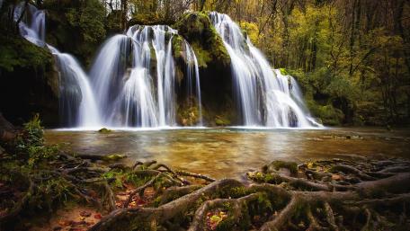 Enchanting Forest Waterfall Scene wallpaper