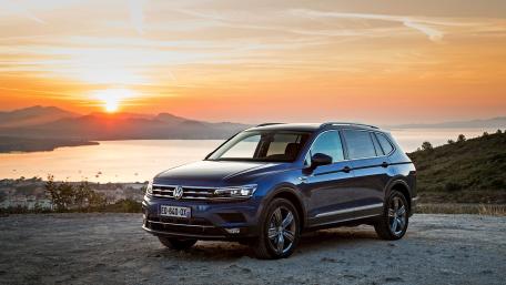 Stylish Volkswagen Tiguan Against Stunning Sunset View wallpaper