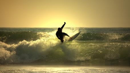 Surfing the Waves at Sunset wallpaper