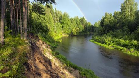 Nature's Serenity with a Rainbow Over the River wallpaper